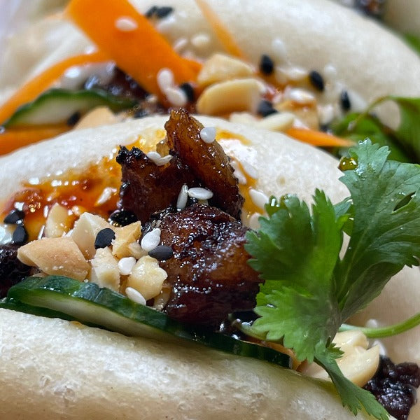 Bao Sandwich with peanut, sesame seed and cilantro