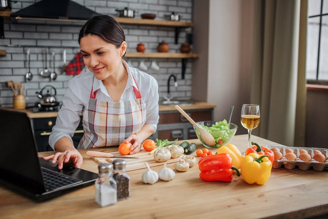 Woman taking a cooking class and preparing her food