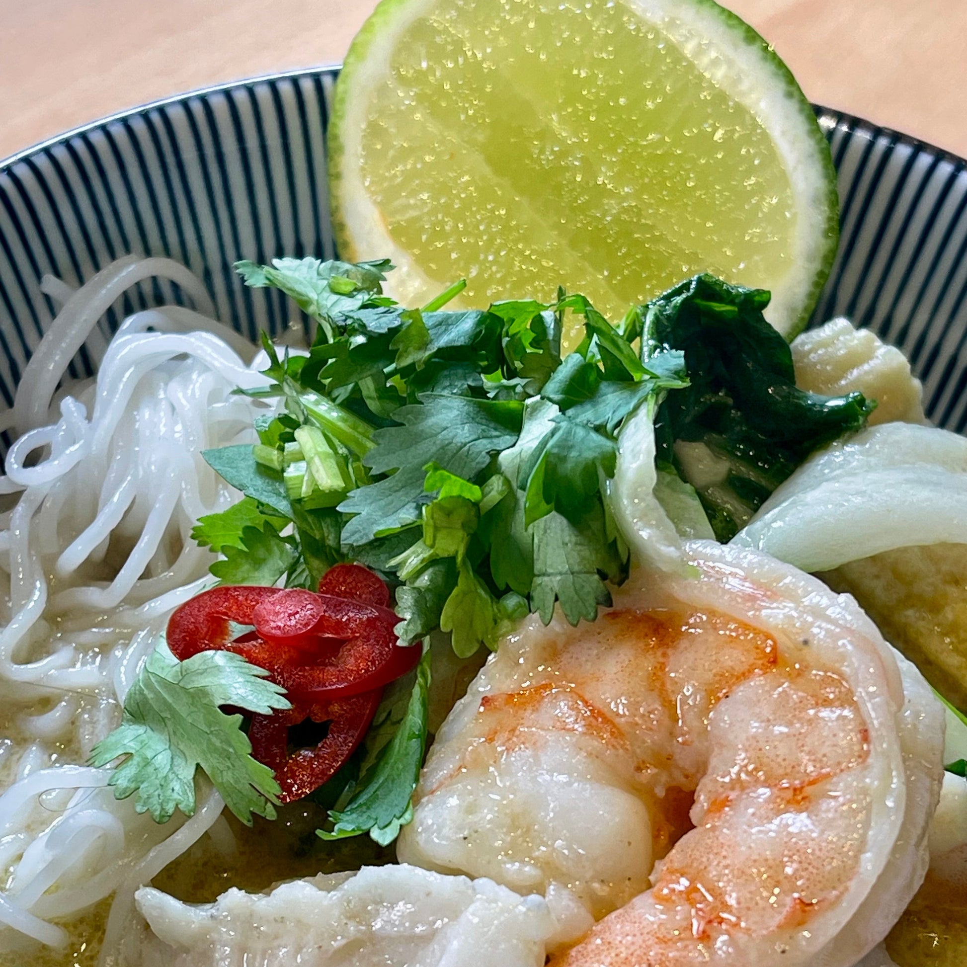 bowl of shrimp thai curry 

