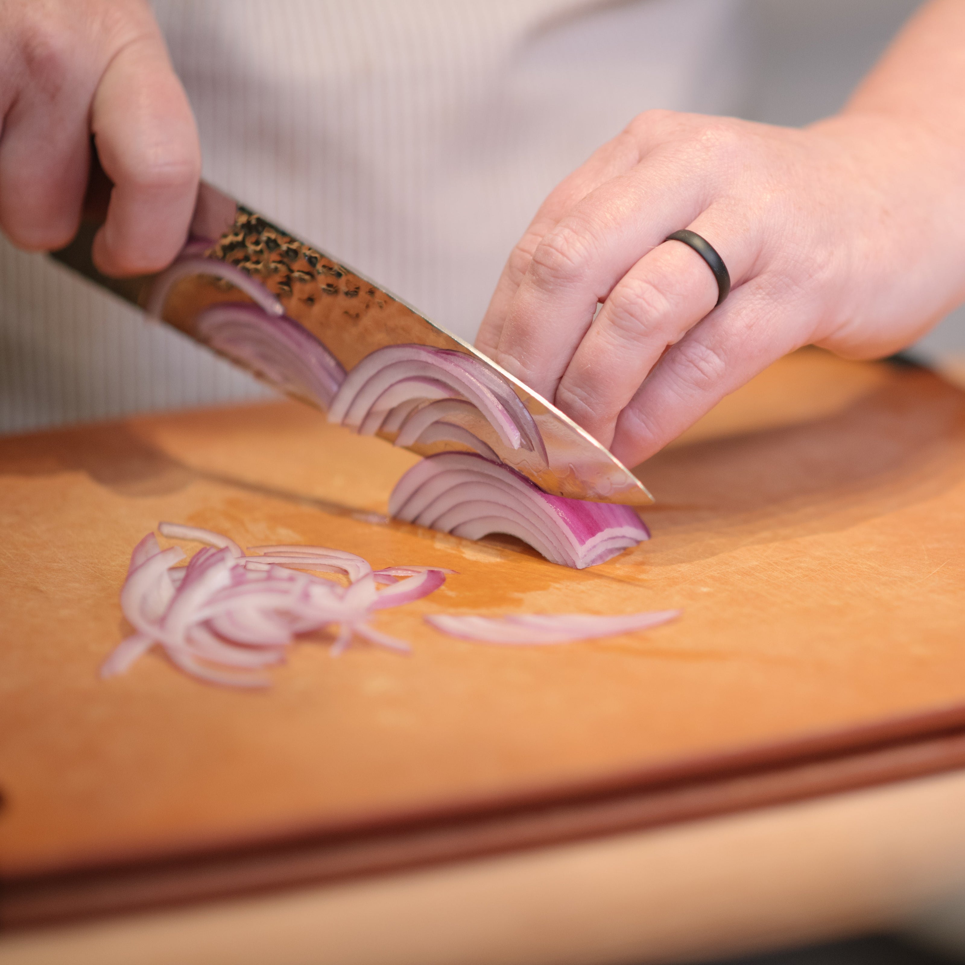 Cutting onions in our knife skills cooking class 